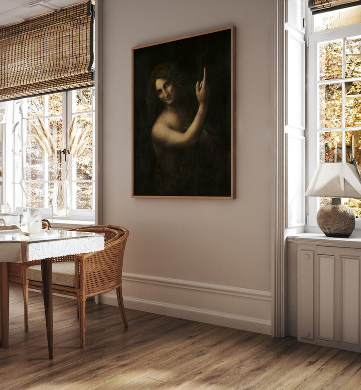 Saint Johan The Baptist Vintage Paintings in Oak Wood Plain Frame placed on the wall between windows behind a table