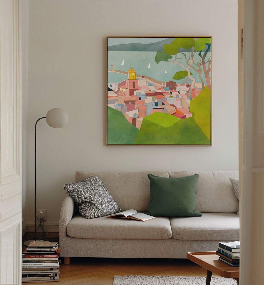 Saint Tropez Kopie II By Ana Rut Bre Landscape Art Prints in Oak Wood Floater Frame placed on a Cream Colored Wall  near a Beige Sofa in the Living Room