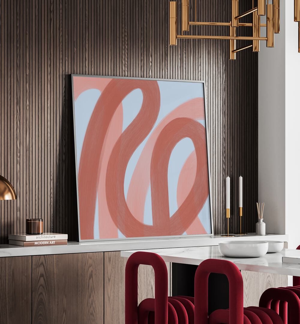 Salon by Yopie Studio Abstract Paintings Abstract Art Prints in Black Plain Frame placed on a console table in a dining room area behind a dining table