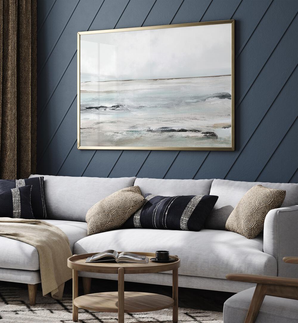 Sandy Bay By Dan Hobday Abstract Art Abstract Paintings in Gold Plain Frame placed on a Blue Colored Wall near a White Sofa in the Living Room