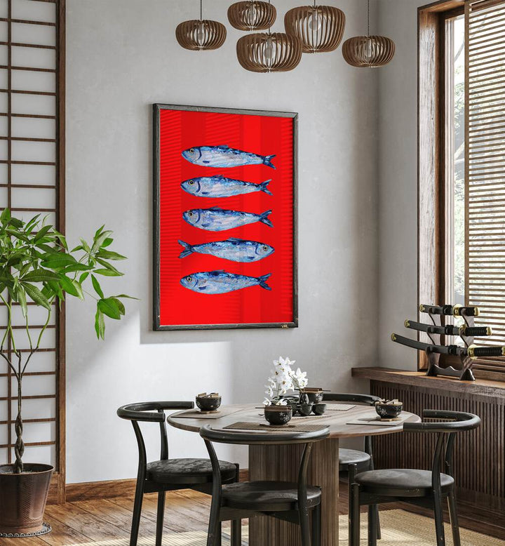 Sardines Berry Red by Alice Straker Kitchen Posters Kitchen Art Prints in Black Plain Frame placed on a wall in a dining room area beside a window and behind a dining table