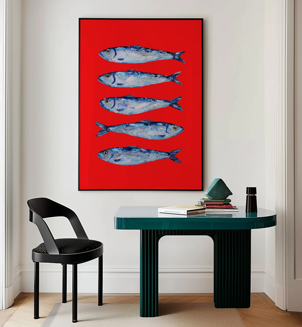 Sardines Berry Red by Alice Straker Kitchen Posters Kitchen Art Prints in Black Plain Frame placed on a wall behind a study table