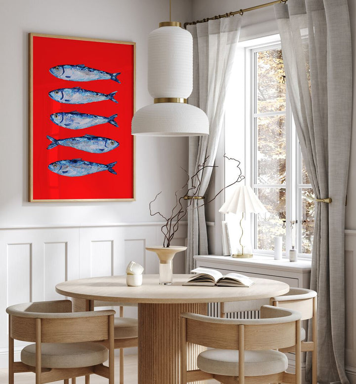 Sardines Berry Red by Alice Straker Kitchen Posters Kitchen Art Prints in Oak Wood Plain Frame placed on a wall in a dining room area beside a window and behind a dining table