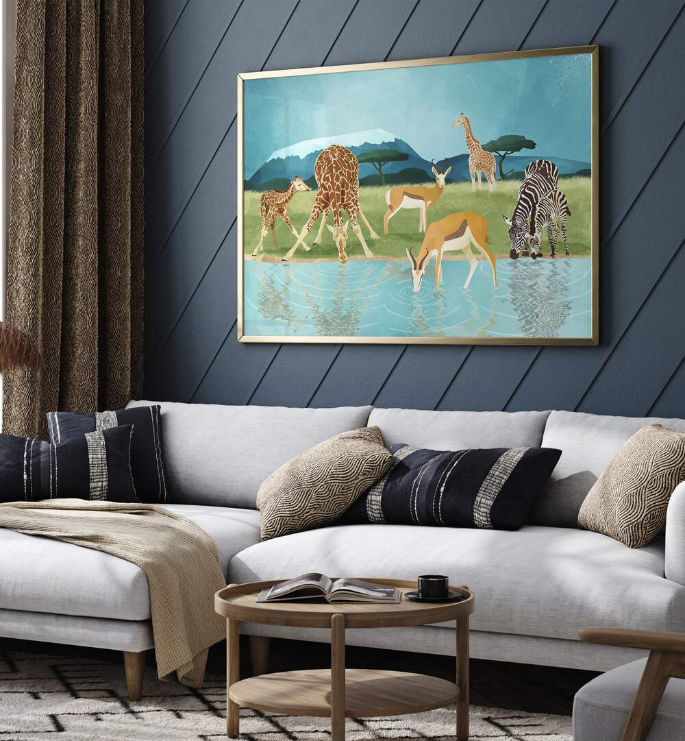 Savannah By Goed Blauw Wildlife Art Prints in Gold Plain Frame placed on a Blue Colored Wall near a White Sofa in the Living Room