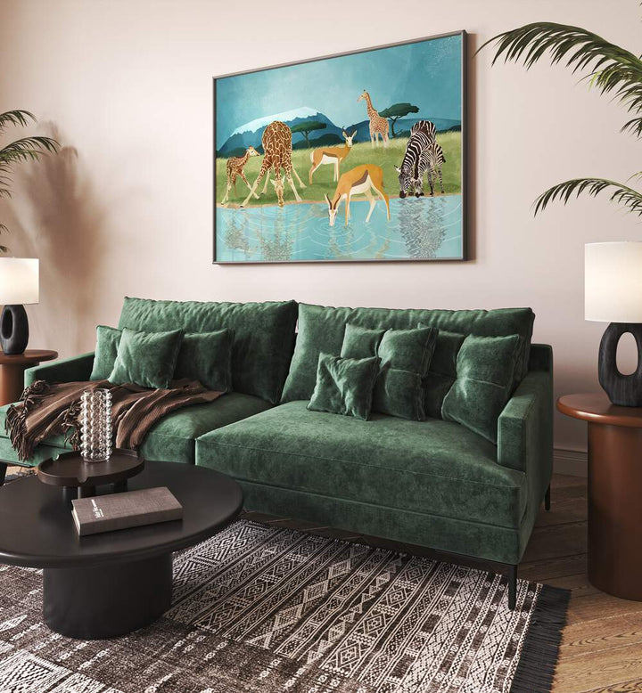 Savannah By Goed Blauw Wildlife Art Prints in Black Plain Frame placed on a Beige Colored Wall near a Green Sofa in the Living Room