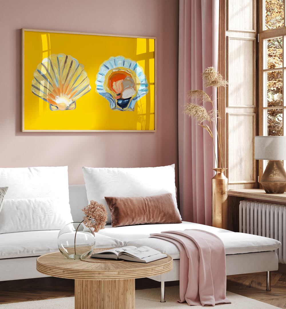 Scallops on Yellow by Alice Straker Cafe Art Prints Cafe Posters in Oak Wood Plain Frame placed on a wall in a living room behind a sofa and beside a window