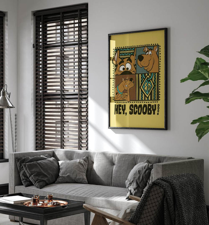 Scooby Doo Comic Wall Art Comic Posters in Black Plain Frame placed on a White Colored Wall near a Grey Sofa in the Living Room