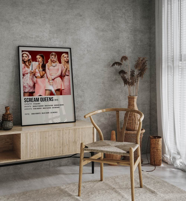 Scream Queens 2015 Movie Posters in Black Plain Frame placed on a table beside oakwood chair