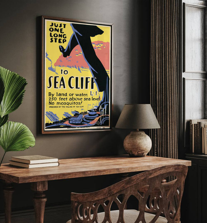 Sea Cliff I Retro Vintage Travel Vintage Travel Posters in Dark Wood Plain Frame on a wall above a study table beside a plant