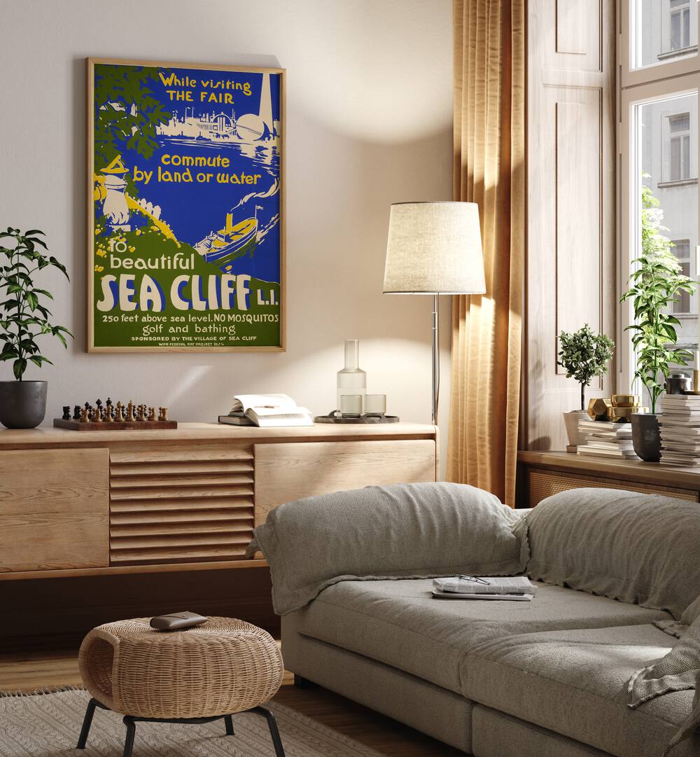 Sea Cliff II  Vintage Travel Posters in Oak Wood Plain Frame placed on a wall behind a console table 