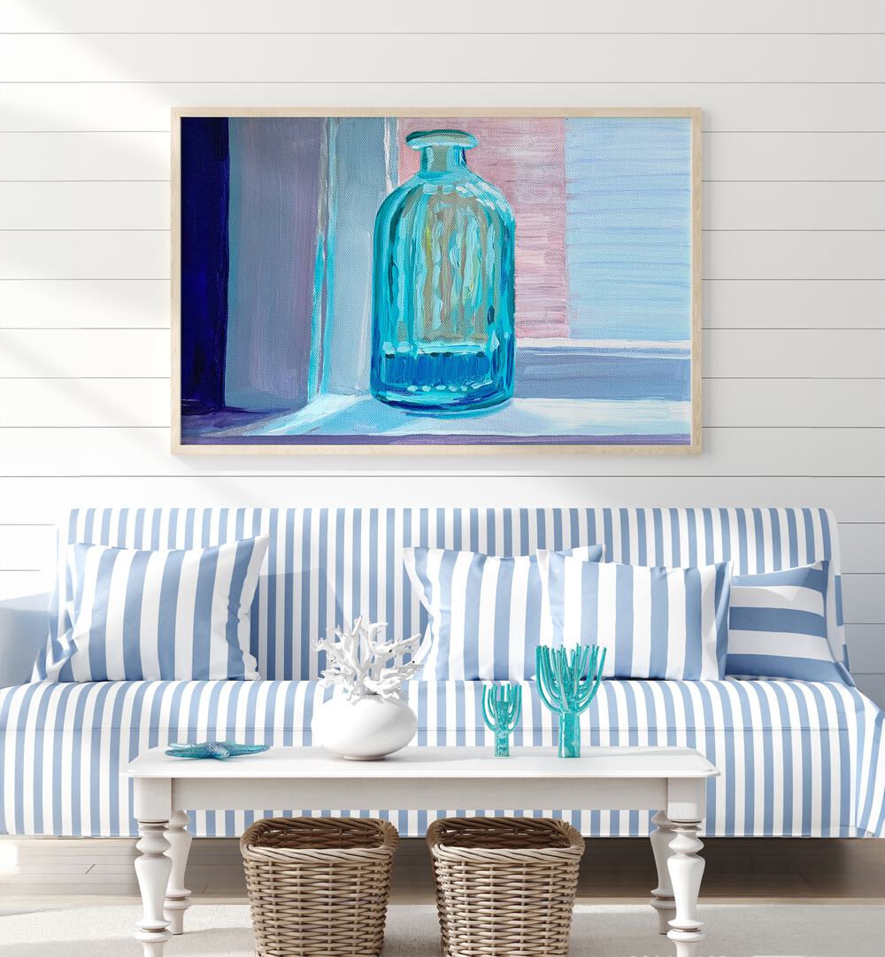 Sea Glass By Key And Sea Creative Art Print in Oak Wood Plain Frame behind a sofa on a white wall