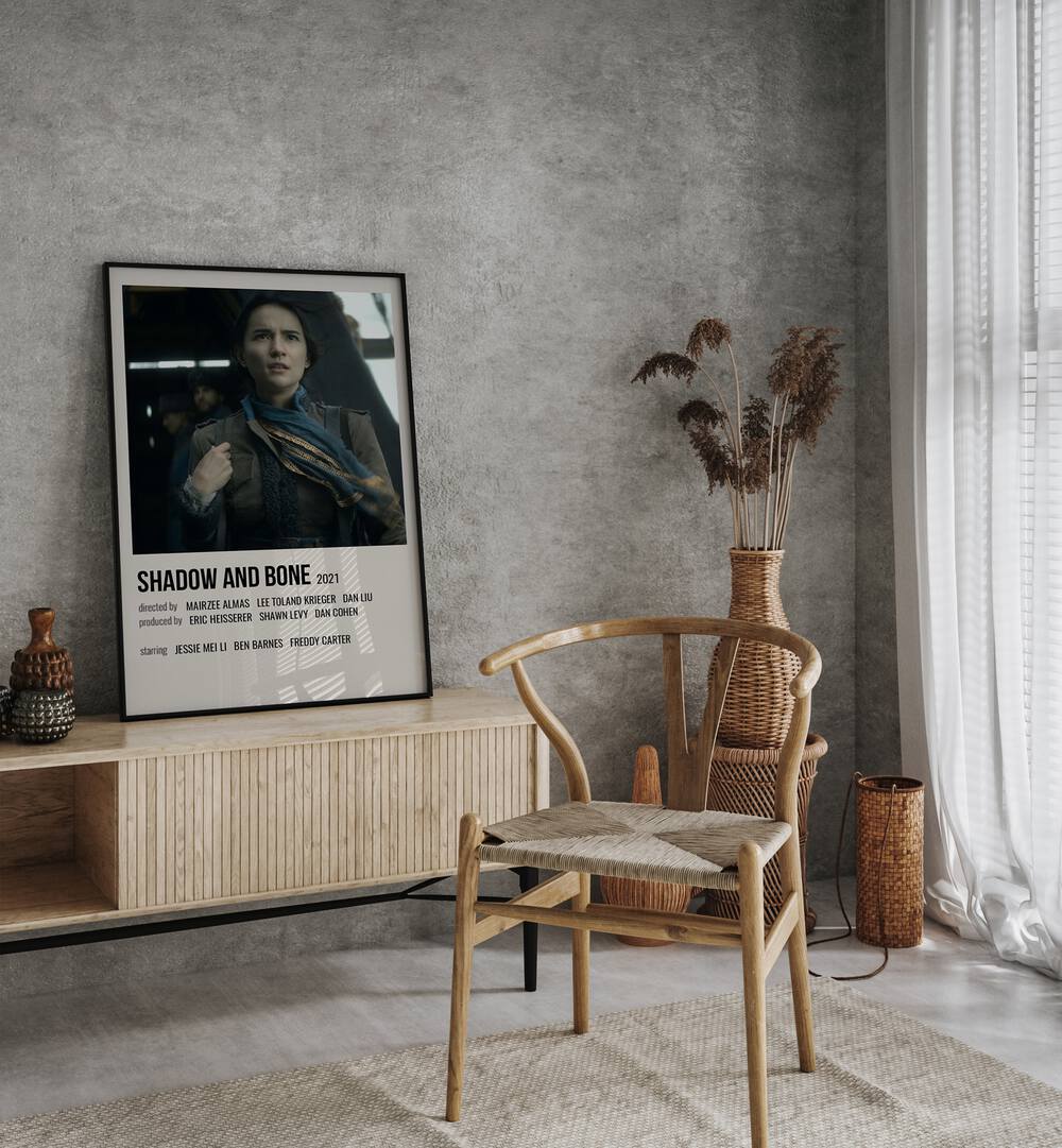 Shadow Bone 2021 Movie Posters in Black Plain Frame placed on a table beside oakwood chair