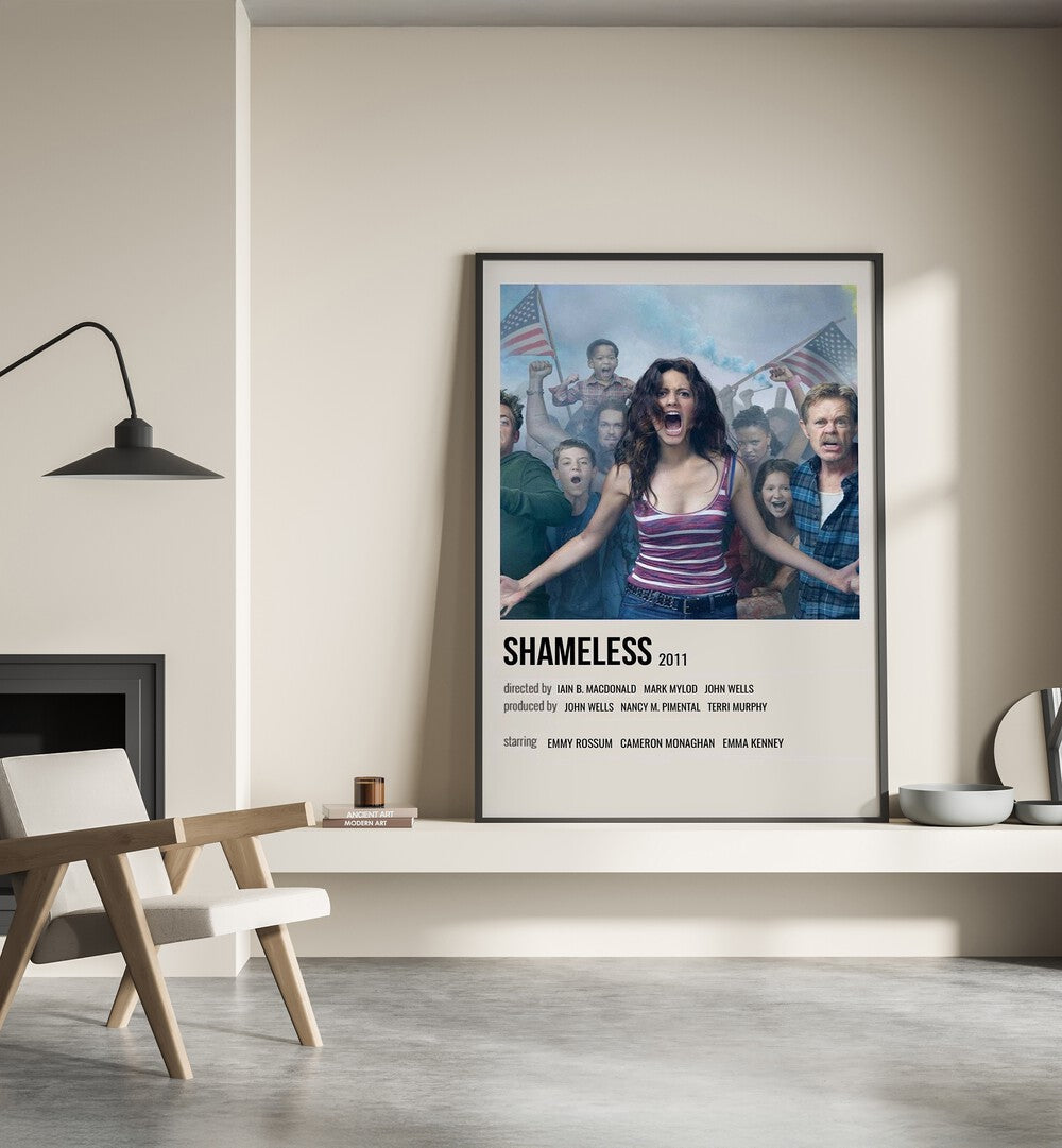 Shameless 2011 iii Movie Posters in Black Plain Frame place on a wall behind a chair beside lamp