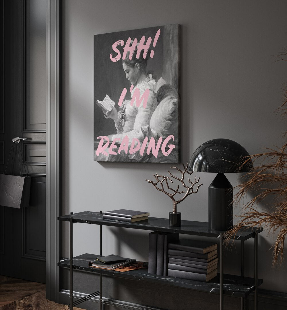 Shh Im Reading By Grace Digital Art Co Altered Art Prints in Gallery Wrap placed on a wall behind a table and beside a door