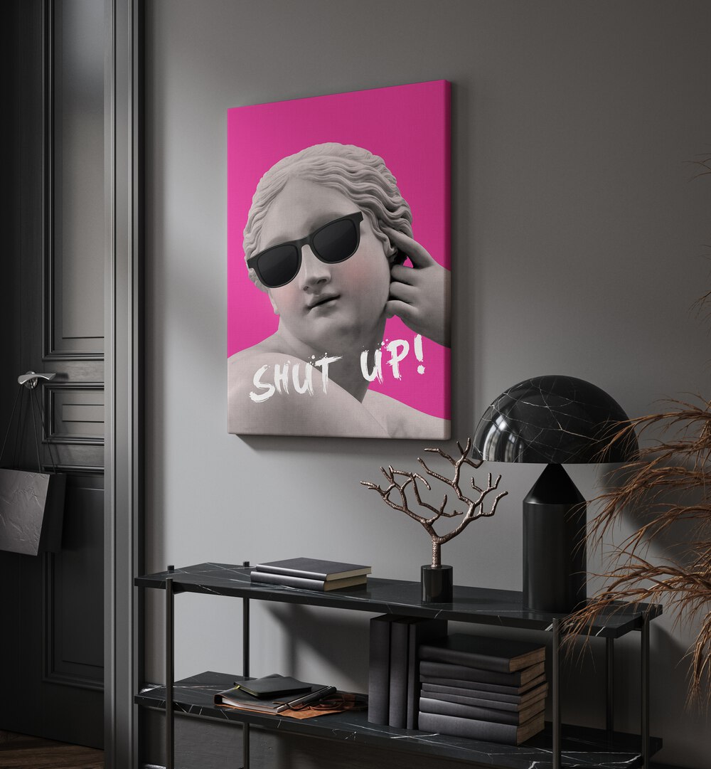 Shut Up II By Grace Digital Art Co Altered Art Prints in Gallery Wrap placed on a wall behind a black table and beside a door