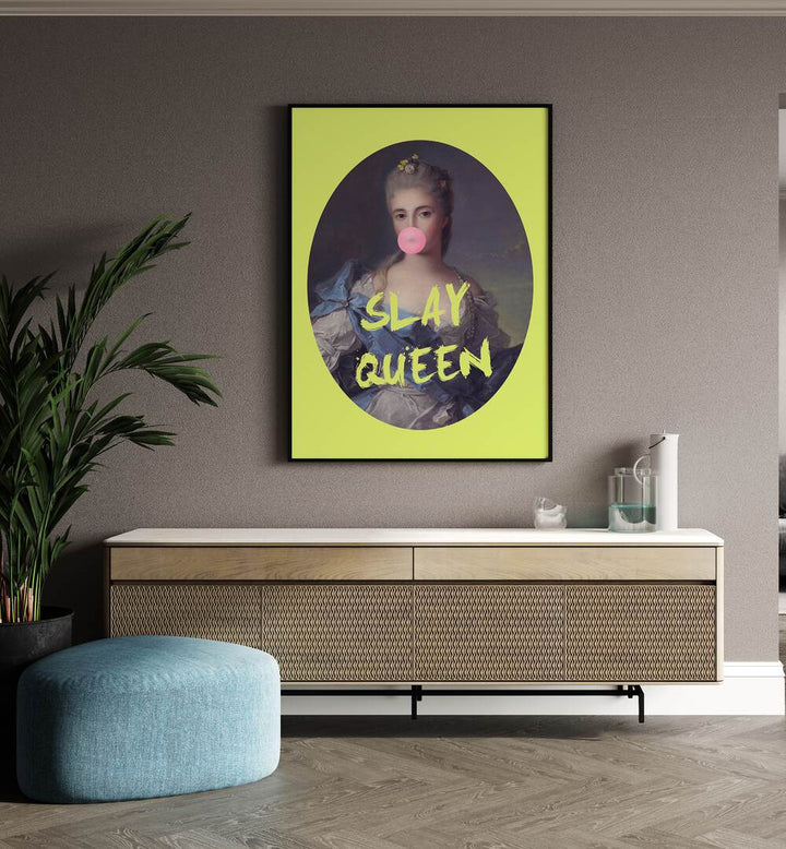 Slay Queen By Grace Digital Art Co Altered Art Prints in Black Plain Frame placed on a wall behind a console table