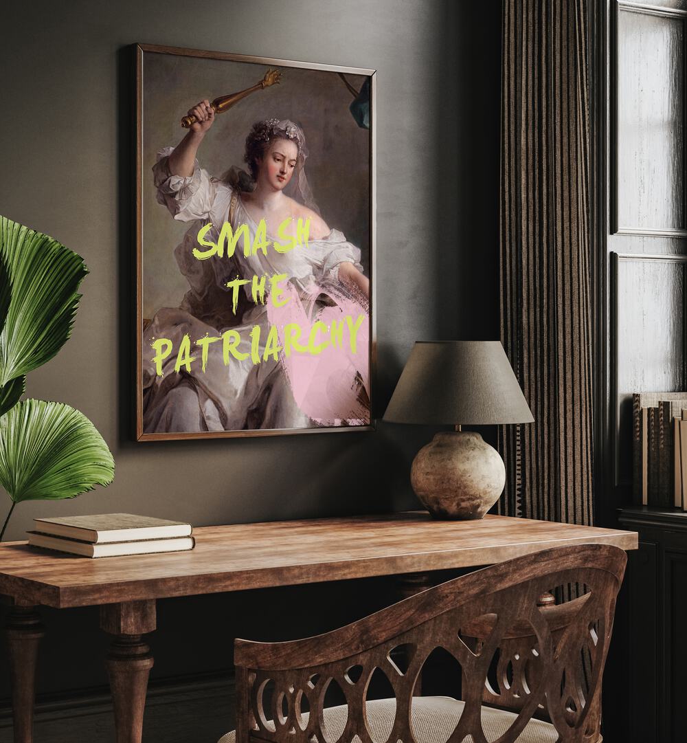 Smash the Patriarchy By Grace Digital Art Co Altered Art Prints in Dark Wood Plain Frame placed on a wall behind a study table