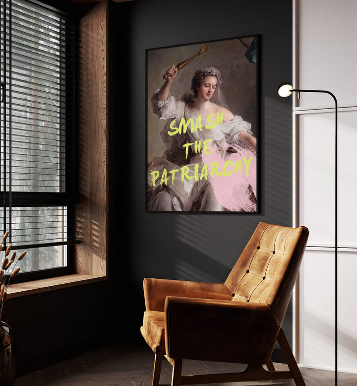 Smash the Patriarchy By Grace Digital Art Co Altered Art Prints in Black Plain Frame placed on a wall beside an orange sofa and a window