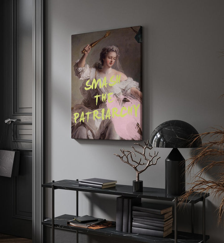 Smash the Patriarchy By Grace Digital Art Co Altered Art Prints in Gallery Wrap placed on a wall behind a black table and beside a door