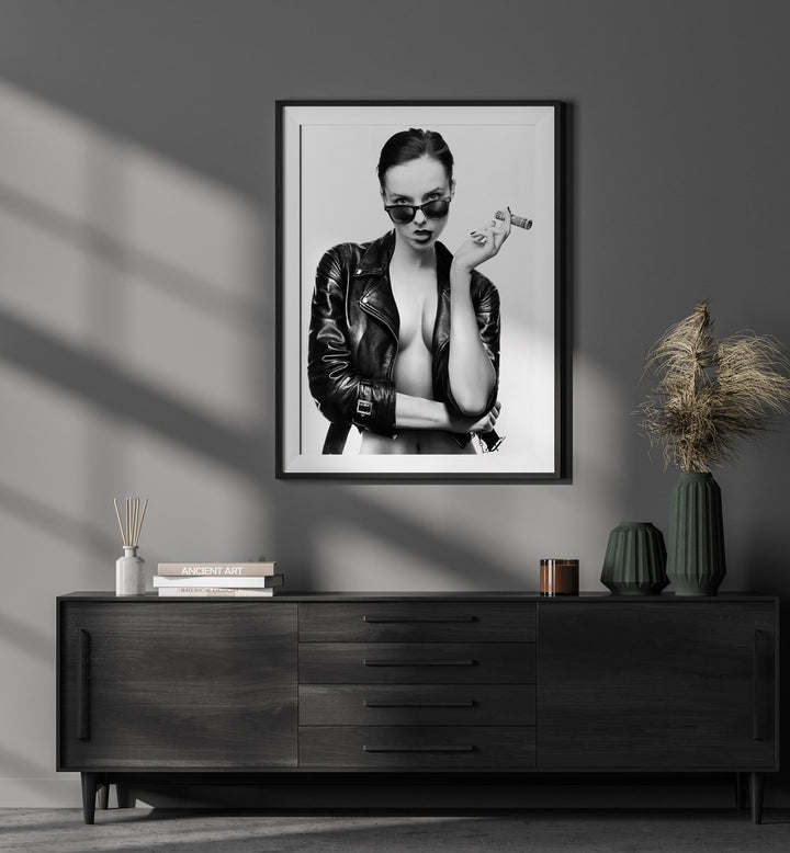 Smoke This ii by David Drake Fine Art Photography Fashion Photography in Black Frame With Mount placed on a wall behind a console table