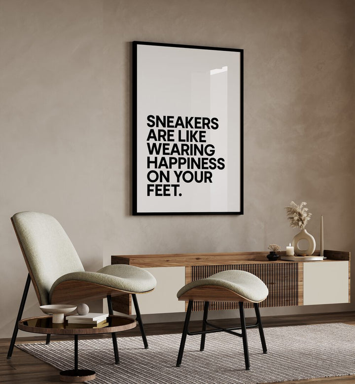 Sneakers Are Happiness Quotes and Typography Posters in Black Plain Frame placed on a wall behind a console table