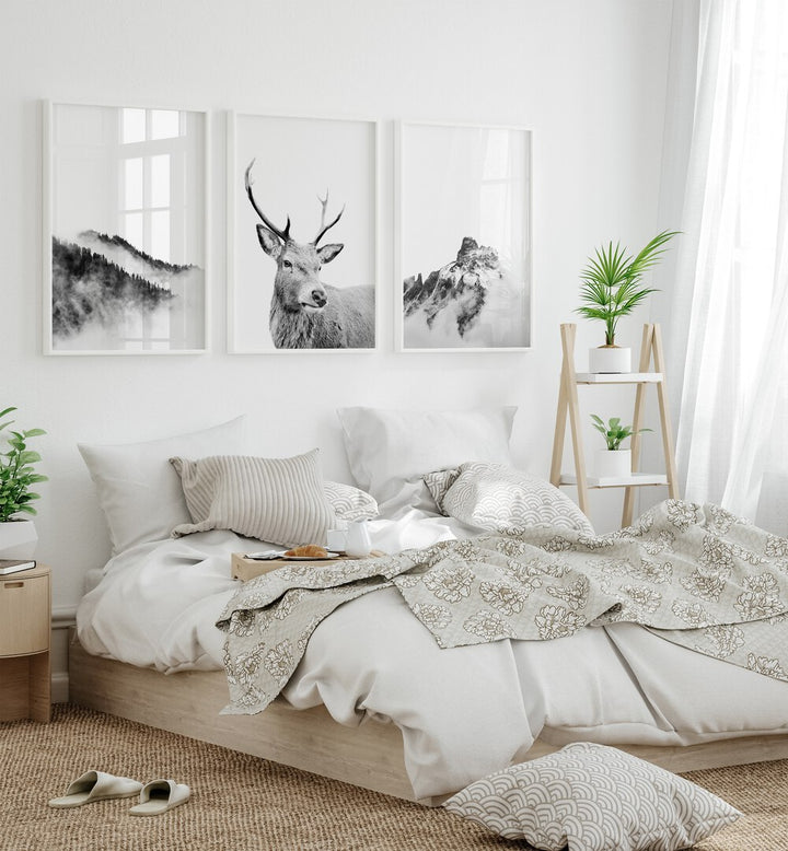 Snow Forest Set Of 3 Paintings in White Plain Frame placed behind a bed for bedroom