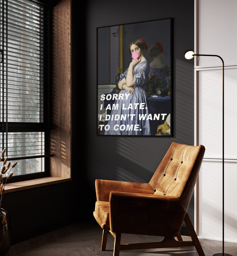 Sorry I Am Late I Didn't Want to Come by the Art Concept Altered Art Prints in Black Plain Frame placed on a wall beside an orange sofa