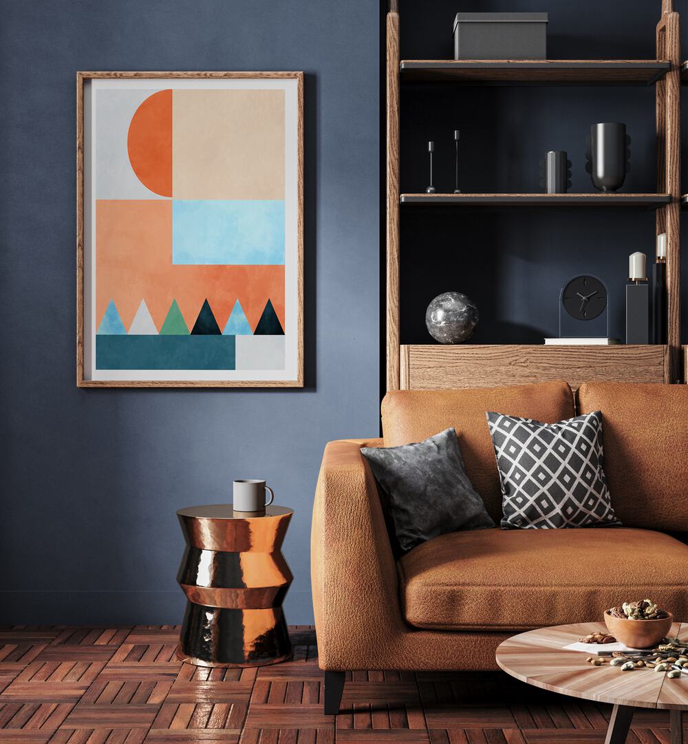 Spaces Bleu Dreieck By Ana Rut Bre Abstract Art Abstract Wall Art in Oak Wood Plain Frame placed on a wall beside a sofa