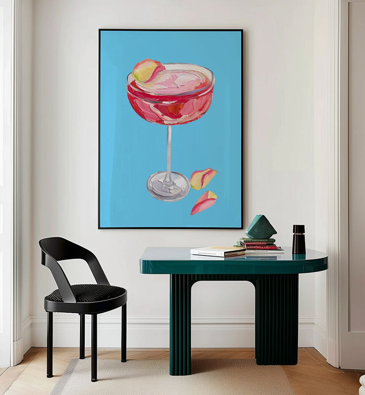 Sparkling Rose Gin Cocktail by Alice Straker Bar Posters Bar Art Prints in Black Plain Frame placed on a wall behind a study table