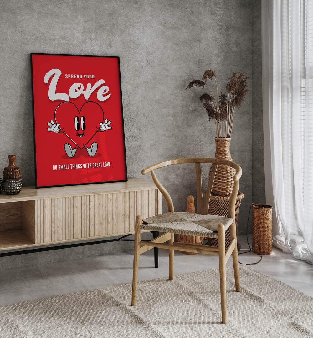 Spread Your Love Quotes and Typography Posters in Black Plain Frame placed on a wall behind a console table