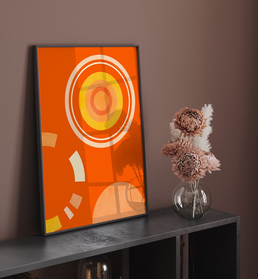 Spring Mid Raphsody Orange IV By Ana Rut Bre Abstract Art Abstract Wall Art in Black Plain Frame placed on a  table