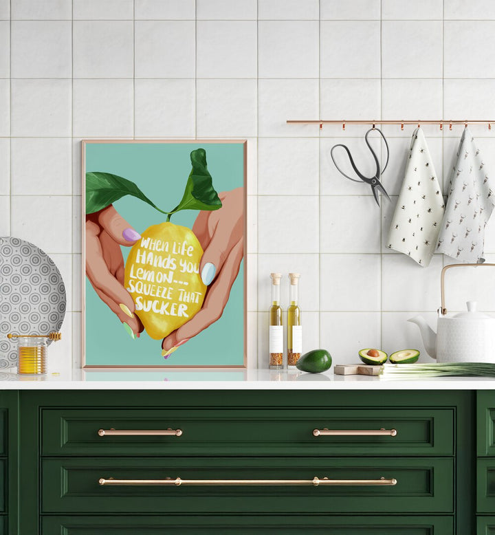 Squeeze That Lemon Kitchen Posters Kitchen Art Prints in Gold Plain Frame placed on a Console Table in the Kitchen