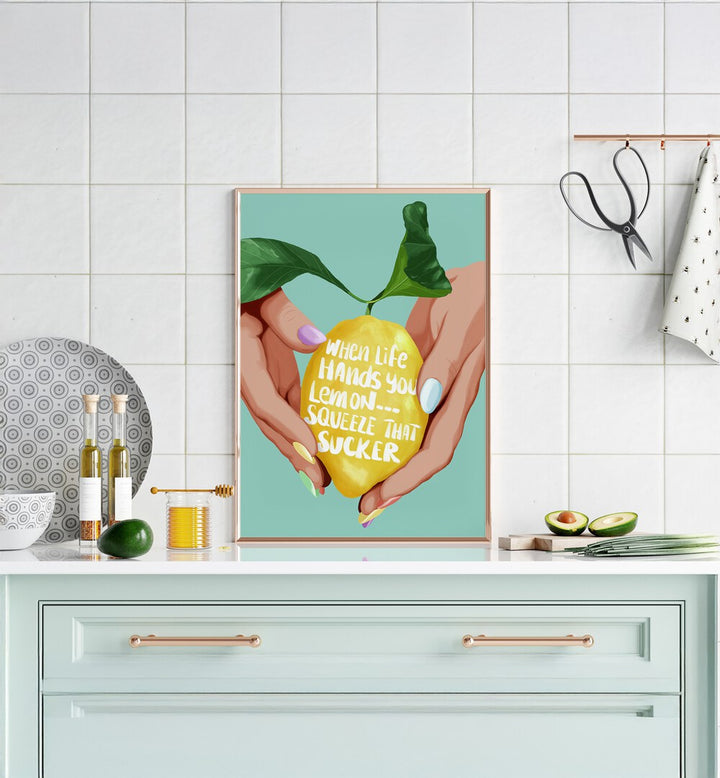 Squeeze That Lemon Kitchen Posters Kitchen Art Prints in Gold Plain Frame placed on a Console Table in the Kitchen