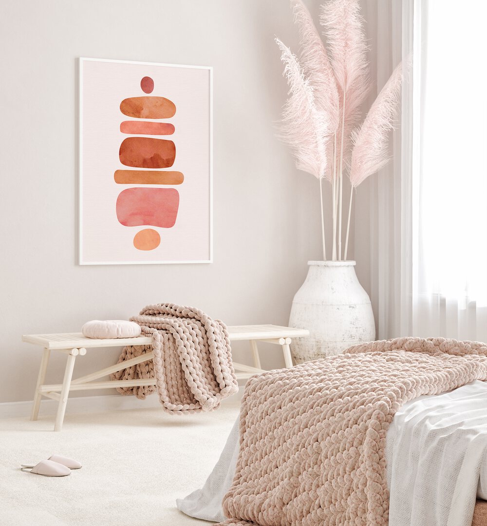 Stacked Stones by Kristian Gallagher Boho Wall Art Paintings Boho Art Prints in White Plain Frame placed on a wall behind a table for bedroom