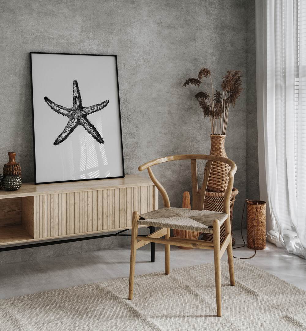 Star Beach Prints Coastal Wall Art in Black Plain Frame placed on a Console Table near a Dark Grey Colored Wall in the Drawing Room