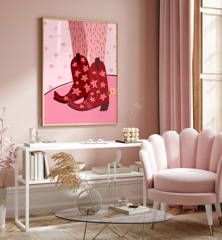 Starry Cow Girl Boots by Athene Fritsch Wall Art Prints Wall Art Printings in Oak Wood Plain Frame placed on a pink wall beside a window and behind a table