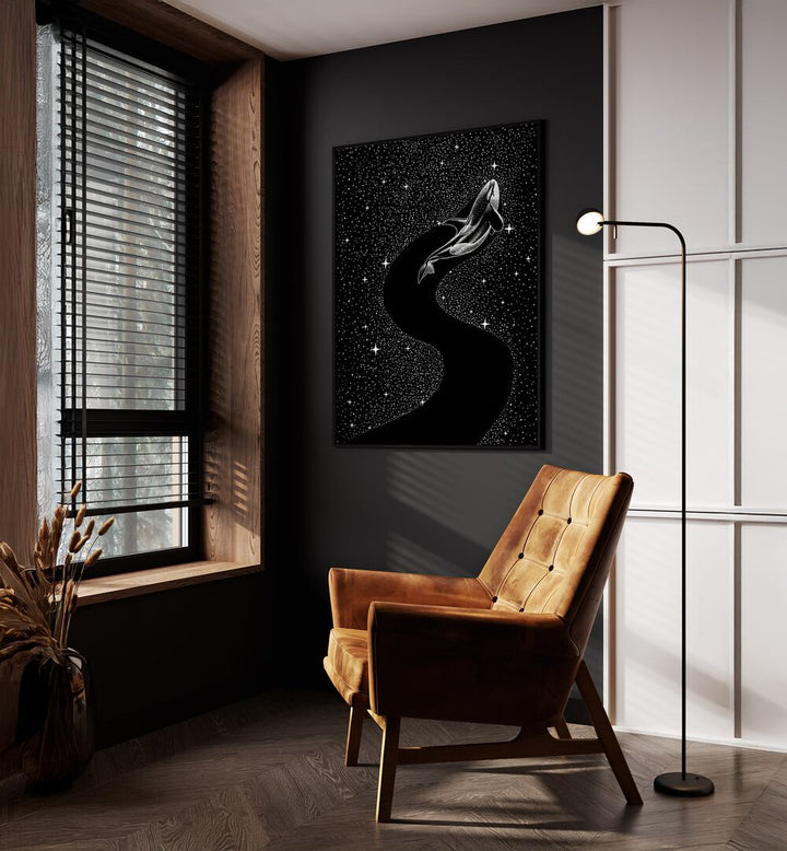 Starry Orca Black Version By Aliriza Cakir Surreal Paintings Surreal Art in Black Plain Frame placed on a Dark Grey Colored Wall near a Brown Sofa Chair in the Drawing Room