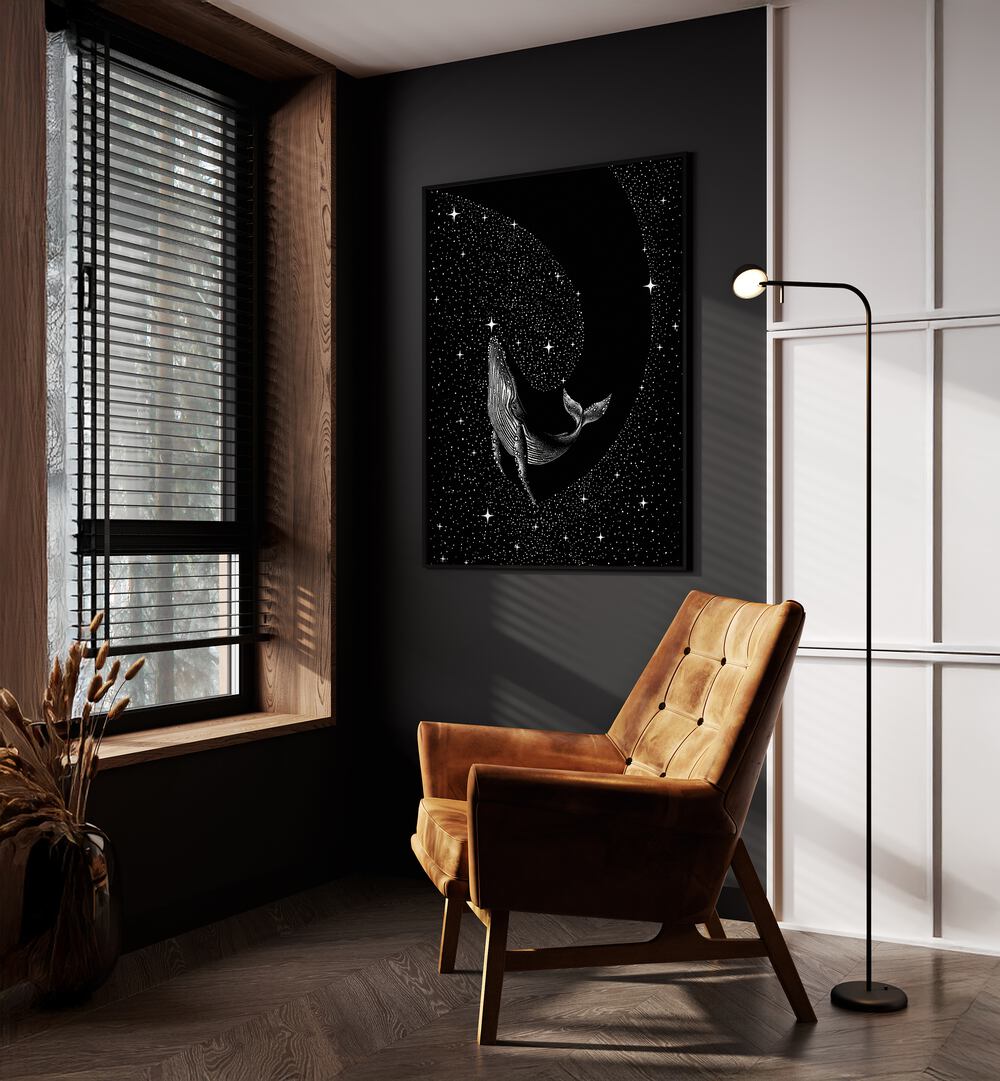 Starry Whale Black Version By Aliriza Çakir Surreal Paintings Surreal Art in Black Plain Frame placed on a Dark Grey Colored Wall near a Brown Sofa Chair in the Drawing Room