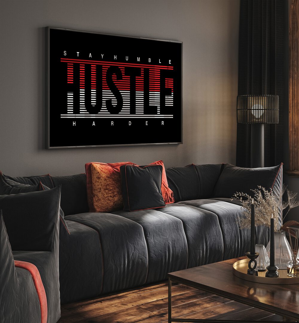 Stay Humble Hustle Harder ii Quotes and Typography Posters in Black Plain Frame placed on a wall in living room behind a sofa