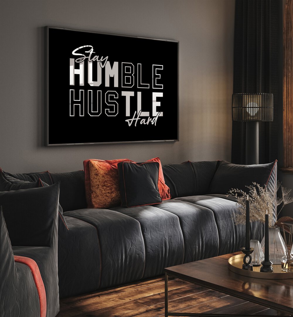 Stay Humble Hustle Harder iii Quotes and Typography Posters in Black Plain Frame placed on a wall in living room behind a sofa