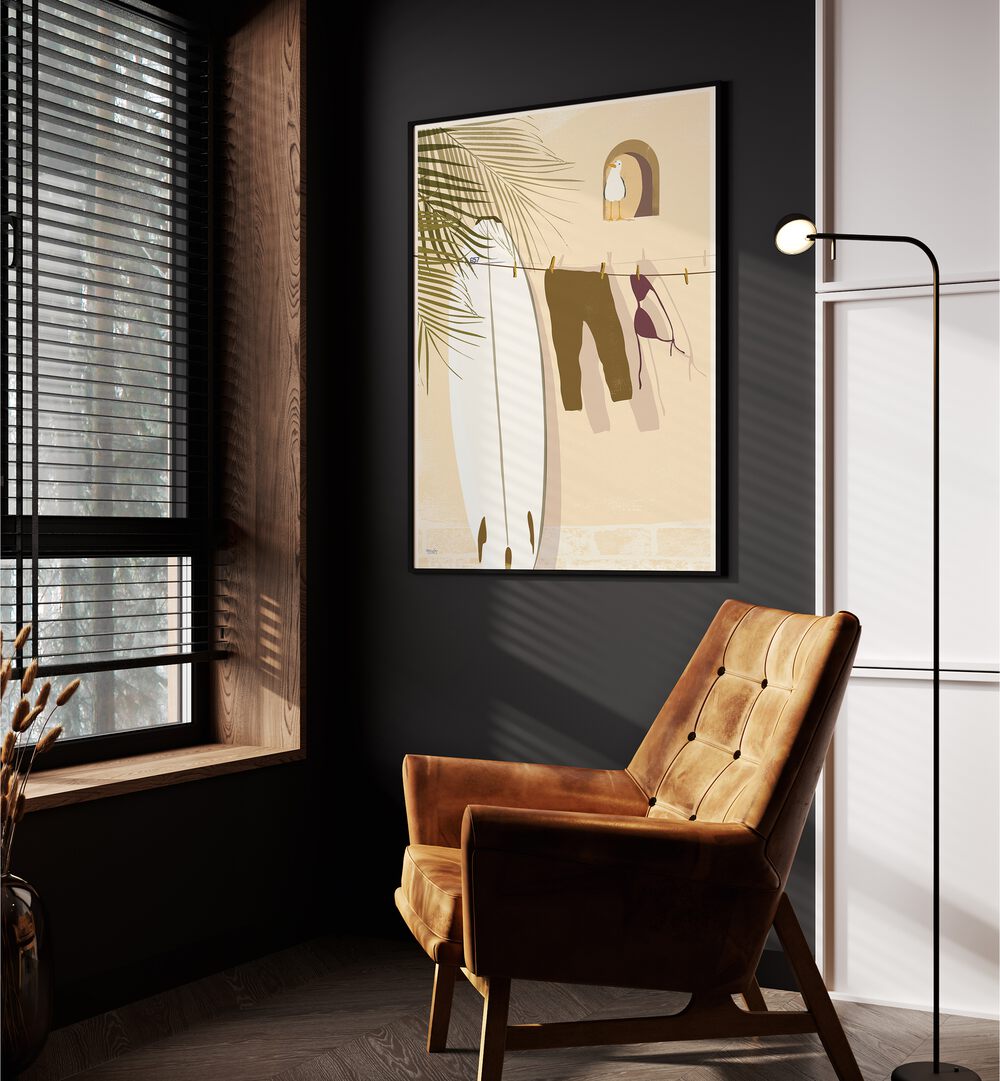 Still Life By Andi Bell Beach Prints in Black Plain Frame on a grey wall placed beside an orange sofa