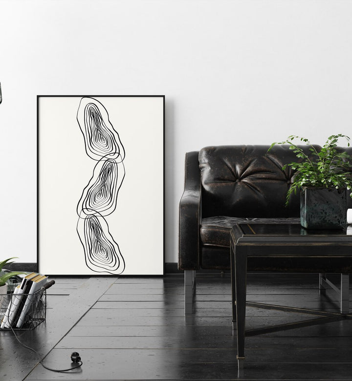 String Of Wood By Grishma Korjani Line Art Prints in Black Plain Frame placed on a Wooden Floor near a White Colored Wall in the Living Room