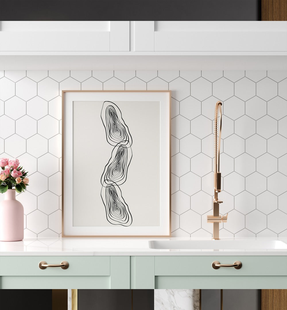 String Of Wood By Grishma Korjani Line Art Prints in Gold Frame With Mount placed on a Kitchen Shelf in the Kitchen