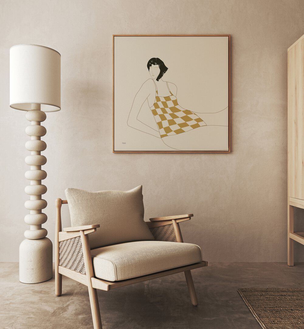 Sun In Squares By Andi Bell Beach Prints in Oak Wood Floater Frame on a beige wall placed behind a sofa 