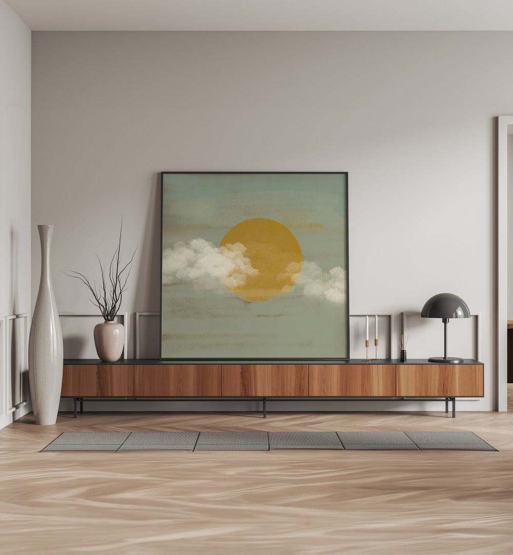 Sun a Clouds by Nilesh Kulkarni Abstract Paintings Abstract Art Print in Black Plain Frame placed on a console table behind a flower vase