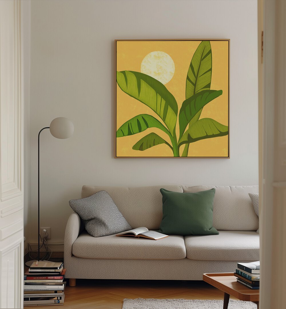 Sunny Golden Tropics by Kristian Gallagher Wall Art Prints in Oak Wood Floater Frame placed on a wall behind a sofa 