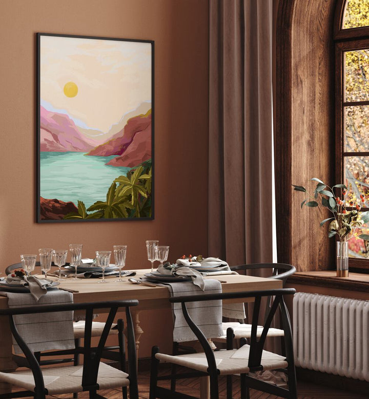 Sunny Paradise By Goed Blauw Landscape Art Prints in Black Plain Frame placed on a Brown Colored Wall near a Dining Table in the Dining Room