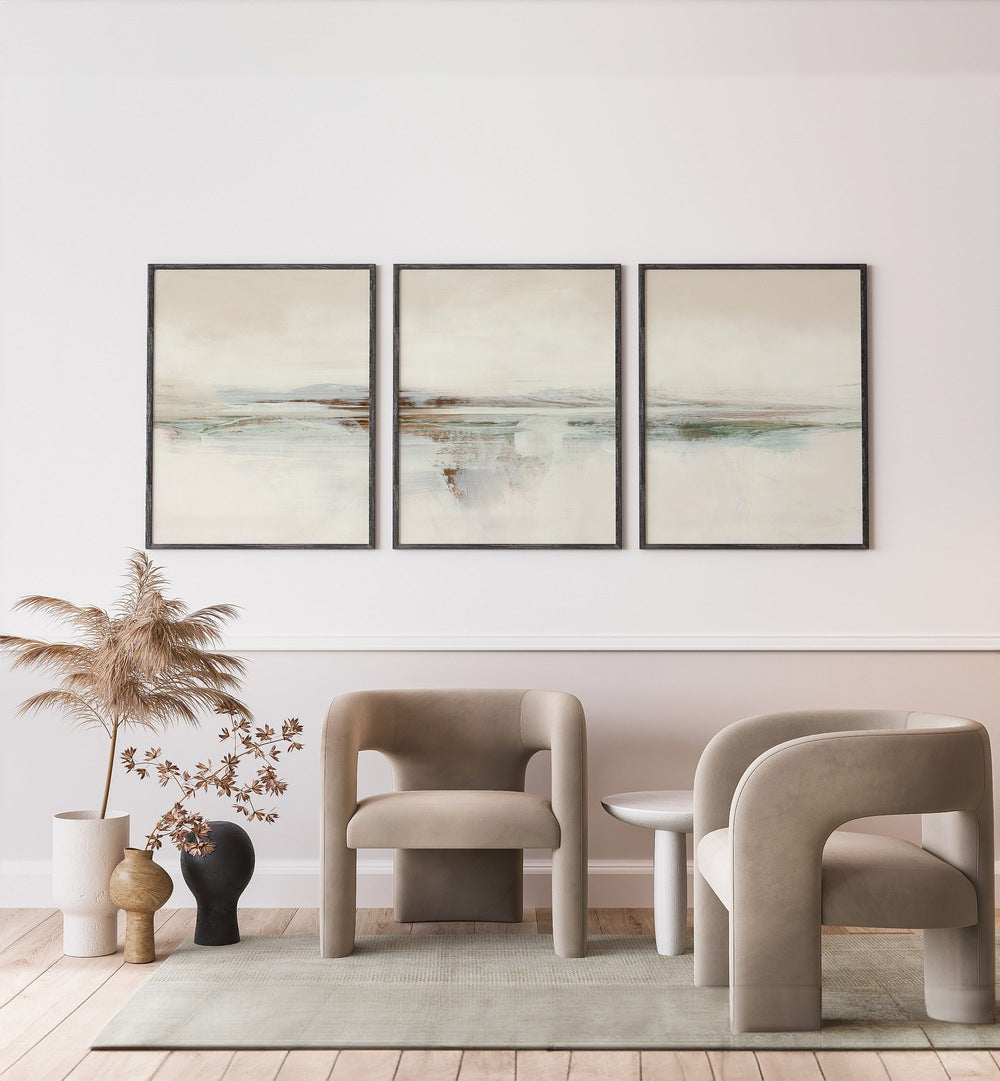 Sunset Abstraction Set Set Of 3 Paintings in Black Plain Frame placed on a white wall behind a chair