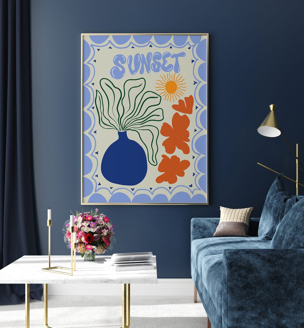 Sunset By Miho Art Studio Botanical Art Prints Floral Paintings in Gold Plain Frame placed on a Blue Colored Wall near a Blue Sofa in the Living Room