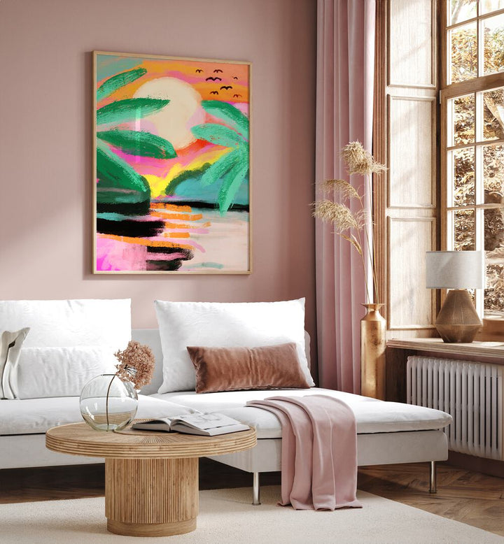 Sunset Island By Treechild Landscape Art Prints in Oak Wood Plain Frame placed on a Pink Colored Wall near a White Sofa in the Living Room